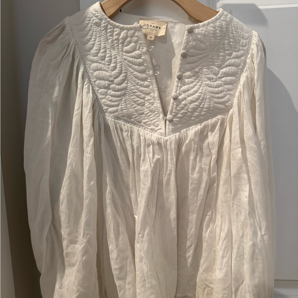 Elegant White Blouse with Embroidered Detail